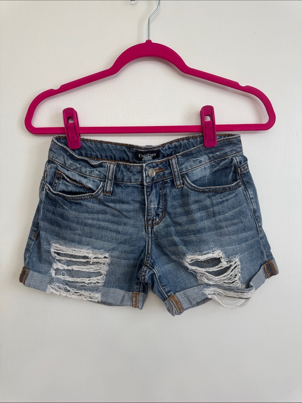 bebe Ripped Roll-Hem Denim Shorts in Blue